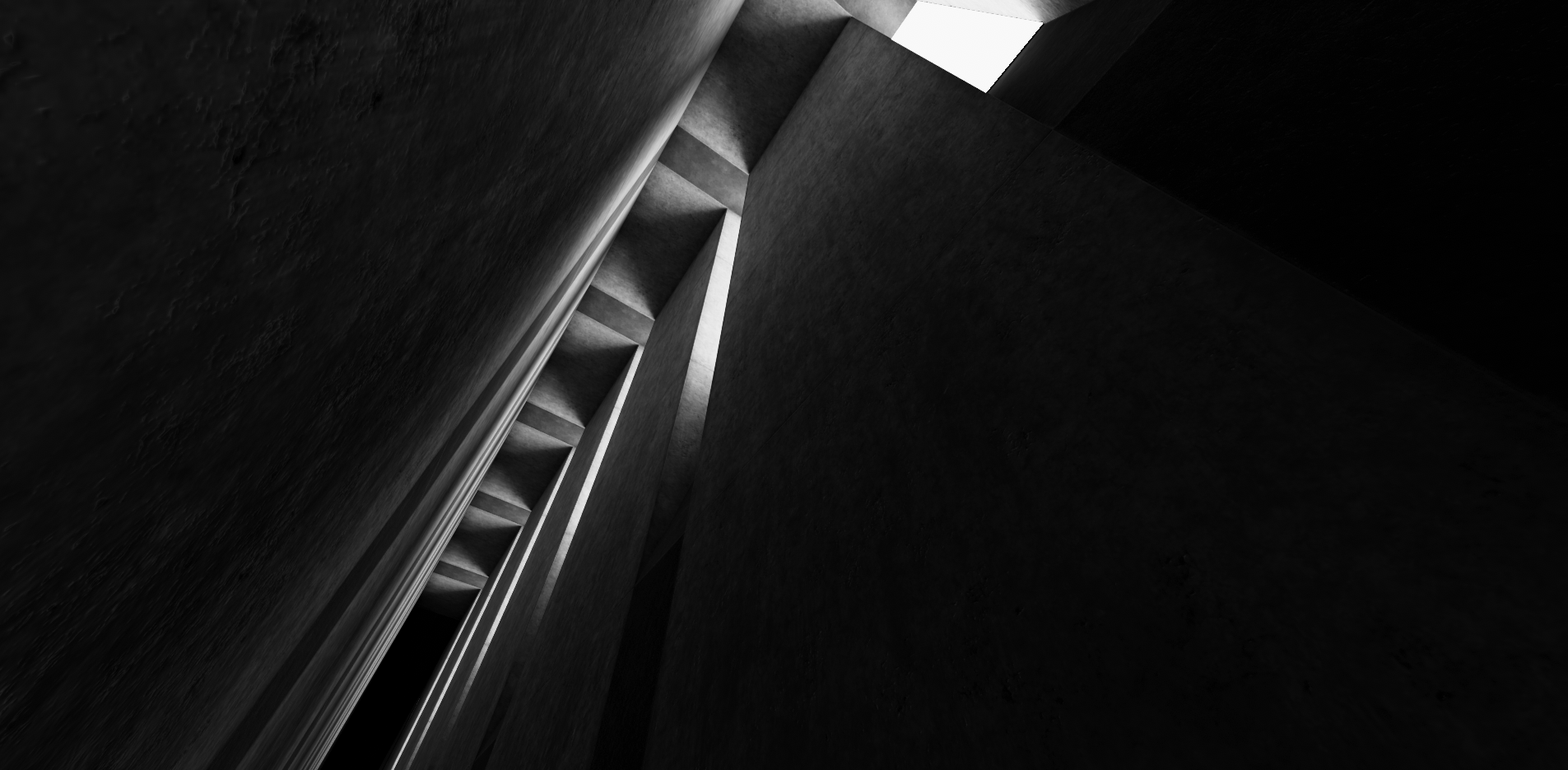 Tall concrete corridor with large slits in the wall where light shines from.